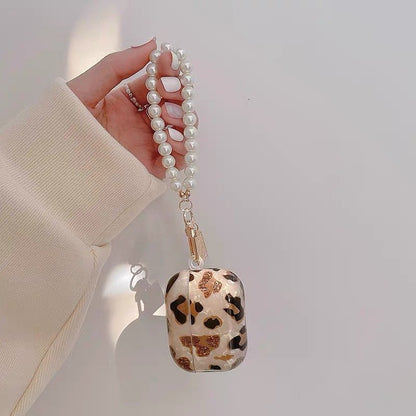 Luxusní pouzdro na AirPods s leopardím vzorem a perlovým řetízkem